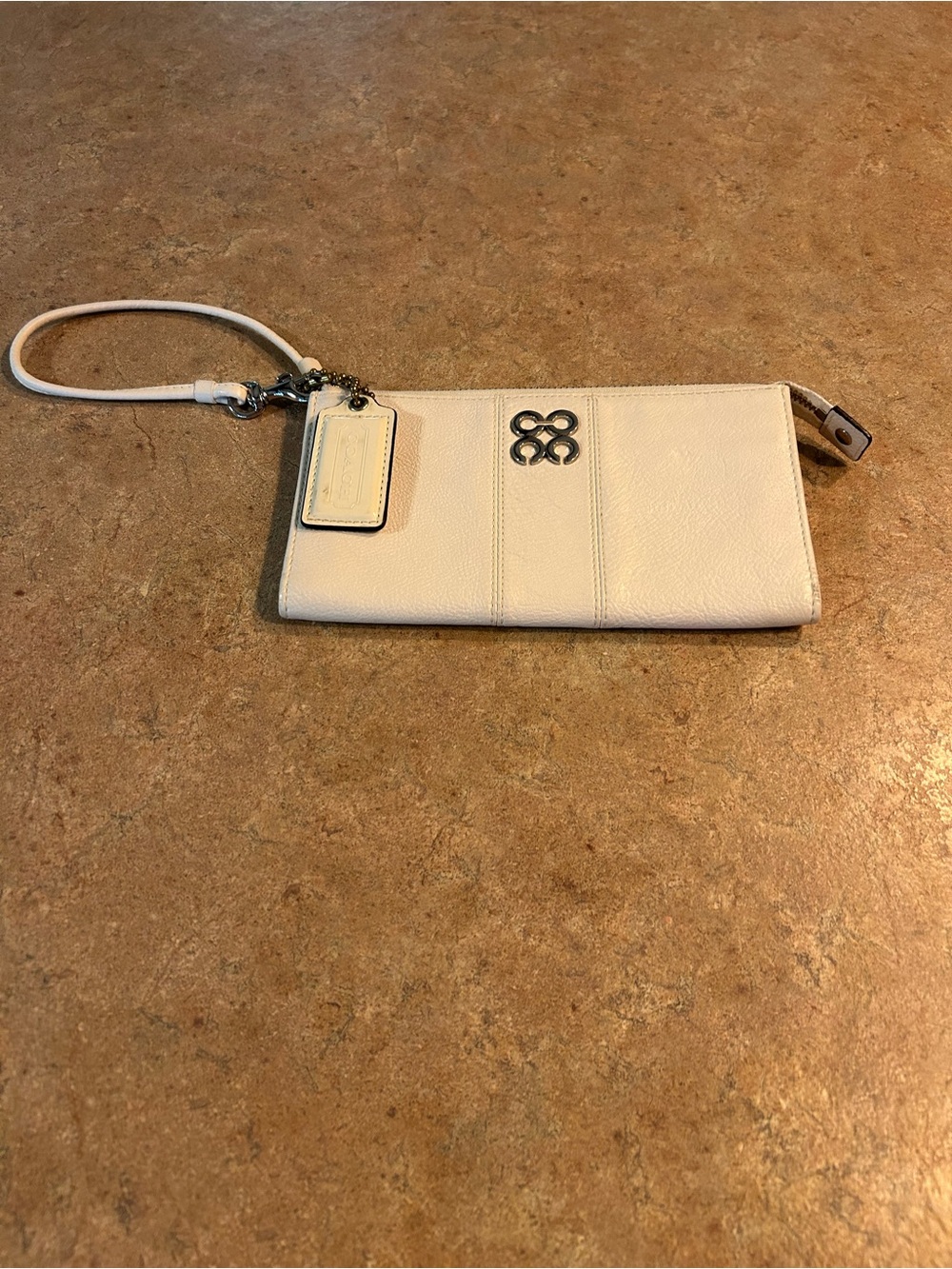Coach Cream Leather Wristlet Clutch with Silver Emblem and coach tag